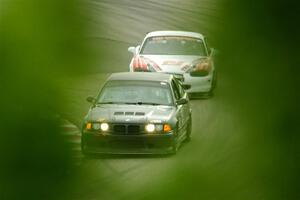C.J. Harayda's SPU BMW M3 and Justin Elder's STL Mazda Miata