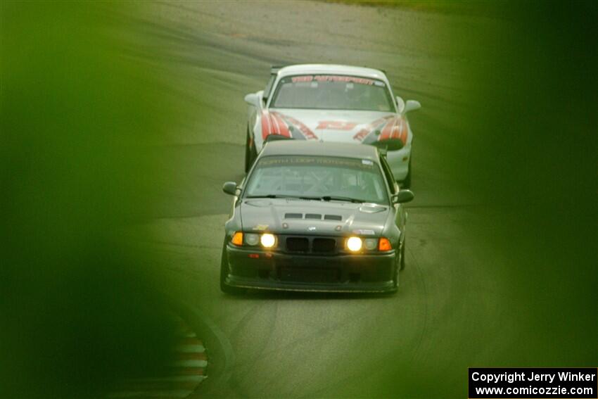C.J. Harayda's SPU BMW M3 and Justin Elder's STL Mazda Miata