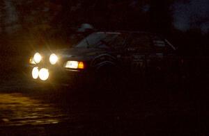 The Chris Huntington / Andy Mohrlant Mazda 323GTX heads uphill at the crossroads hairpin spectator location.