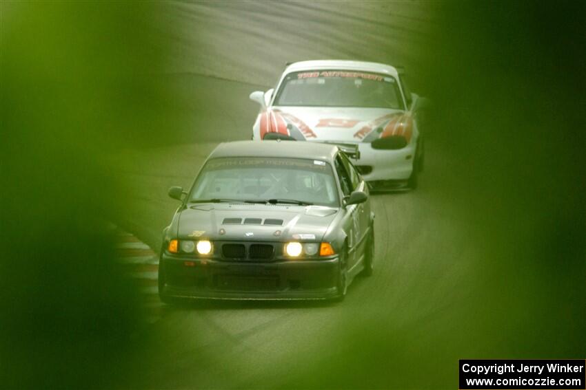 C.J. Harayda's SPU BMW M3 and Justin Elder's STL Mazda Miata
