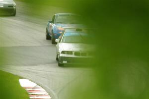 Joe Bungert's ITJ BMW 318ti and Geoff Youngdahl's STL Mazda Miata