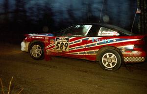 The Mike Cienkosz / Yurek Cienkosz Mitsubishi Eclipse GSX heads uphill at the crossroads spectator hairpin.