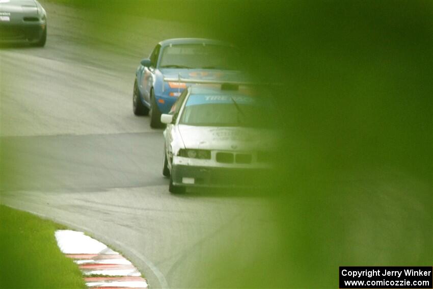 Joe Bungert's ITJ BMW 318ti and Geoff Youngdahl's STL Mazda Miata