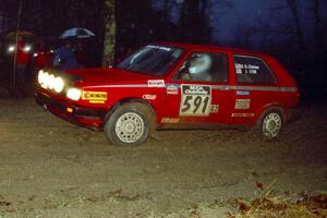 Dave S. Cizmas / Dave L. Cizmas VW GTI heads uphill at the crossroads spectator hairpin.