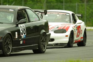 C.J. Harayda's SPU BMW M3 and Justin Elder's STL Mazda Miata