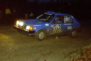 Dave Sterling / Stacy Sehr head uphill at the crossroads spectator hairpin in their Dodge Omni GLH.