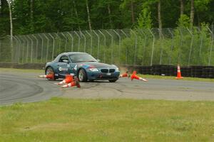 Roger Knuteson's T4 BMW Z4 goes off at turn 8.