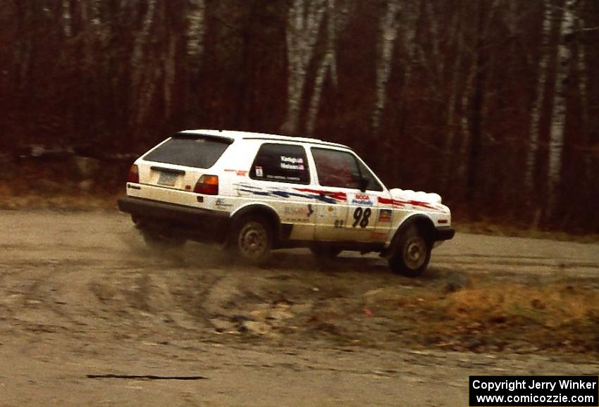 Bob Nielsen / Al Kintigh come past at speed at the crossroads spectator location in their VW GTI.