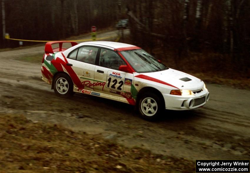 Dennis Martin / John Dillon go past the crossroads spectator location in their Mitsubishi Lancer Evo IV.