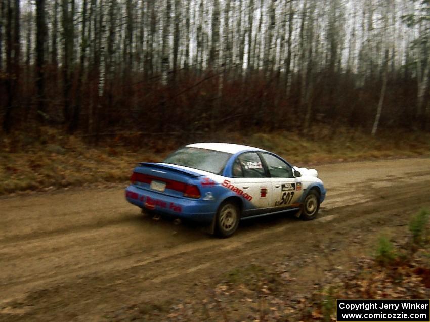 Micah Wiitala / Jane Wiitala at speed on East Steamboat Rd. in their Saturn SL2.