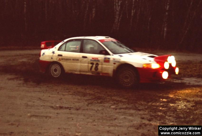 Paul Dunn / Pete Gossett head uphill at the crossroads spectator location in their Mitsubishi Lancer Evo IV.