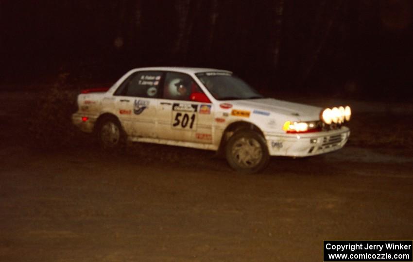 Todd Jarvey / Rich Faber head uphill at the crossroads hairpin spectator location in their Mitsubishi Galant VR4.