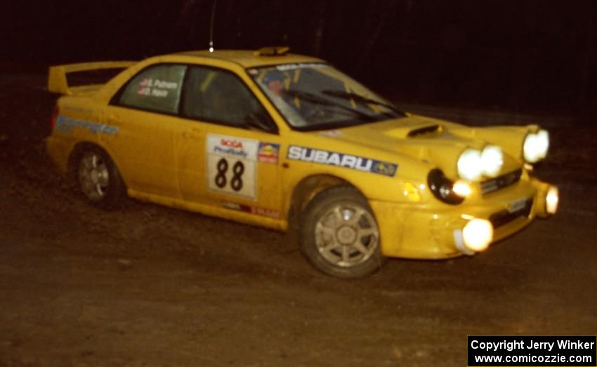 The Doug Havir / Scott Putnam Subaru WRX STi heads uphill at the crossroads hairpin spectator location.