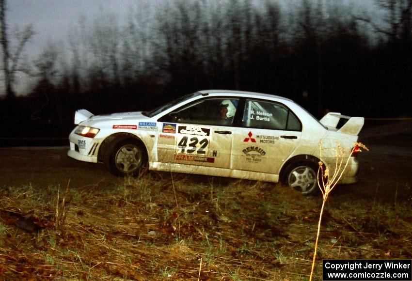 The Ron Nelson / Rick Burtis Mitsubishi Lancer Evo VII heads uphill at the crossroads hairpin spectator loaction.