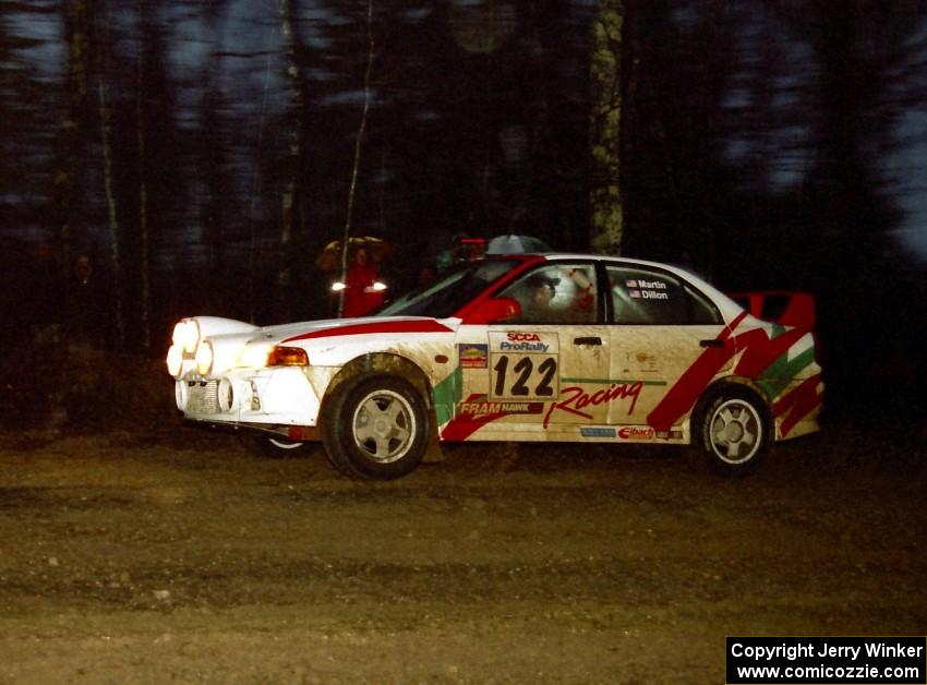 Dennis Martin / John Dillon head uphill at the crossroads spectator location in their Mitsubishi Lancer Evo IV.