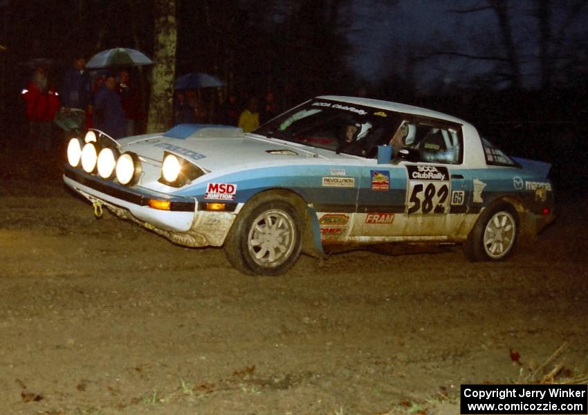 Doug Dill / Tyler Dill head uphill at the crossroads spectator hairpin in their Mazda RX-7.