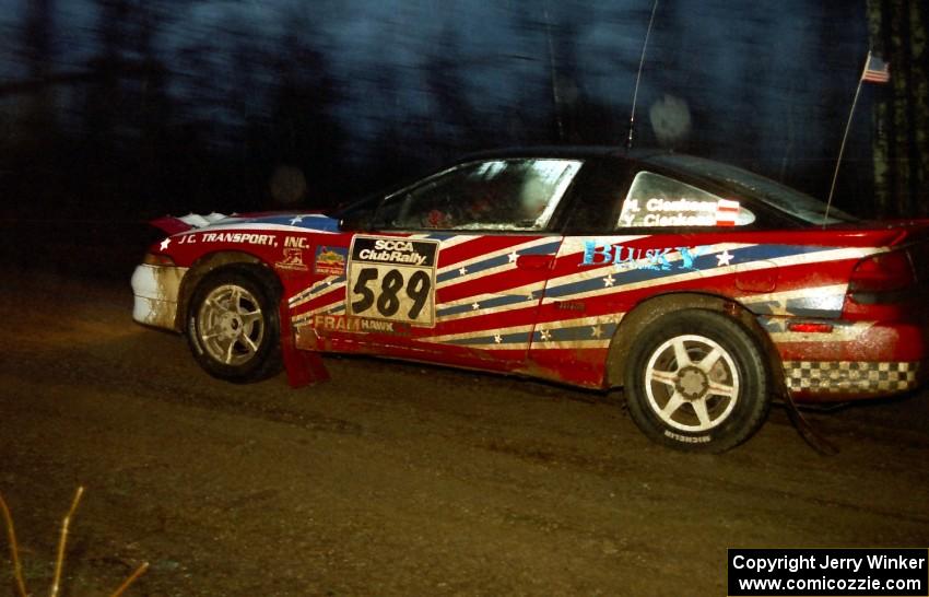 The Mike Cienkosz / Yurek Cienkosz Mitsubishi Eclipse GSX heads uphill at the crossroads spectator hairpin.