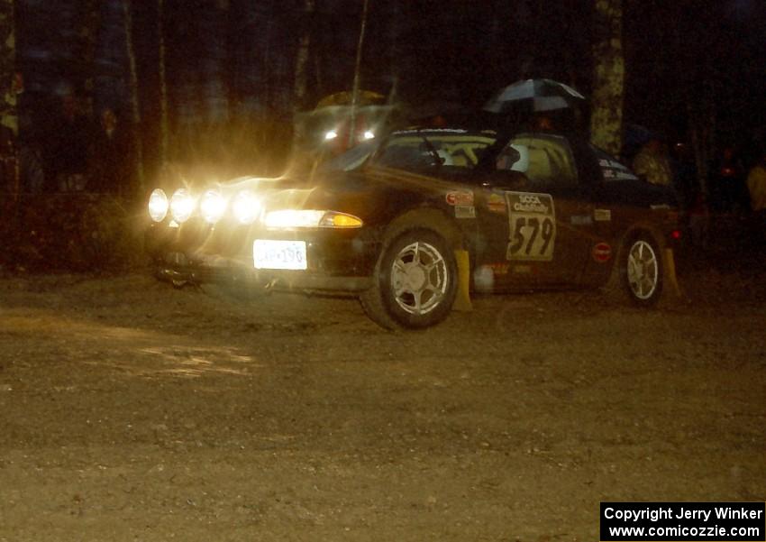 The Brian Rehbein / Crystal Johnston Plymouth Laser heads uphill at the crossroads spectator hairpin.