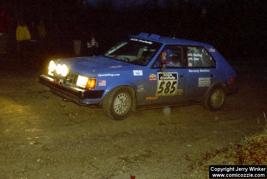 Dave Sterling / Stacy Sehr head uphill at the crossroads spectator hairpin in their Dodge Omni GLH.