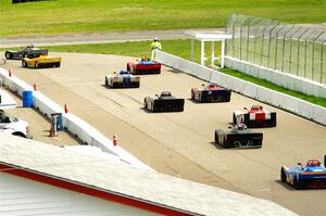 The Spec Racer Ford 3 field comes through pit lane to start the pace lap.