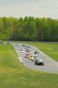 The Spec Racer Ford 3 field comes through turns 5 and 6 on the pace lap.