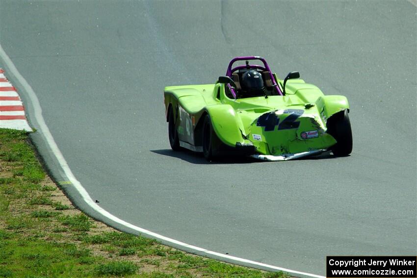 Bob Barton's Spec Racer Ford 3 drives along with heavy damage.