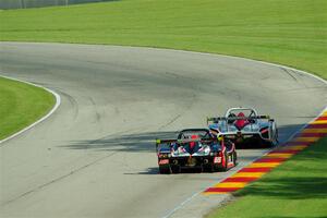 Jim Booth's Radical SR8 leads Dave Tweedlie's Radical SR8 RX through turn 13.