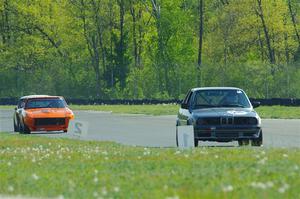 Jessica Johnk's BMW 325i, Tim Homes' Datsun 240Z and Scott McQueen's Austin-Healey 100-6