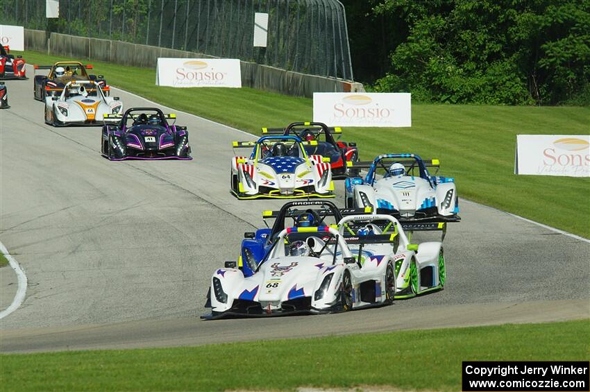 The Radical Cup field streams into turn 3 on lap one of race #1.