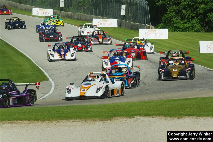 The Radical Cup field streams into turn 3 on lap one of race #1.