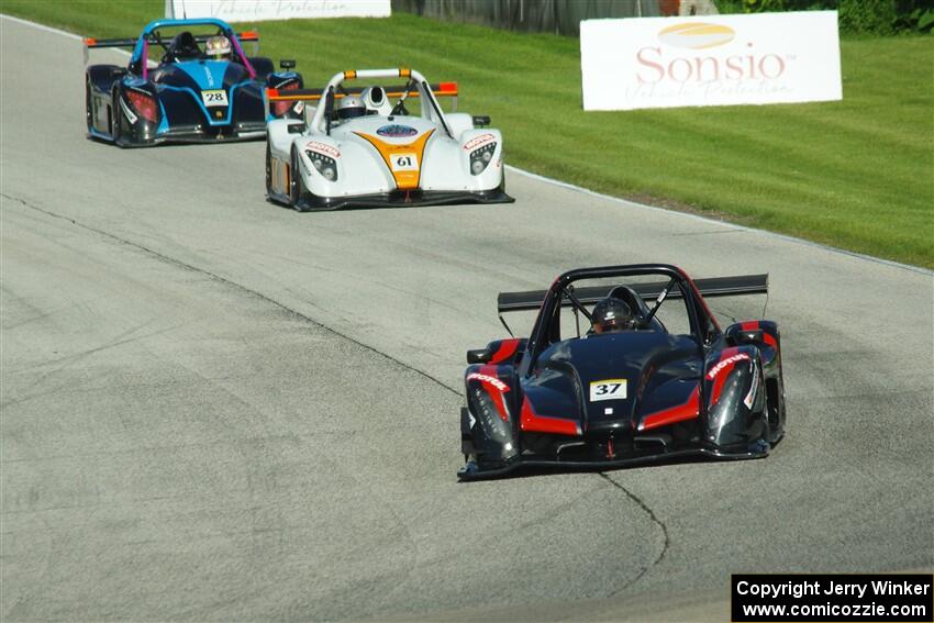 Jon Field's Radical SR10, Reece Everard's Radical SR3 RSX 1500 and Gustavo Rafols' Radical SR3 RSX 1500