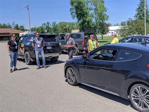 Workers line up to head out to the stages before the start of the event.