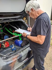 Steve McNaughton checks the Bret Hunter / Melissa Sherowski Ford Fiesta ST during tech.