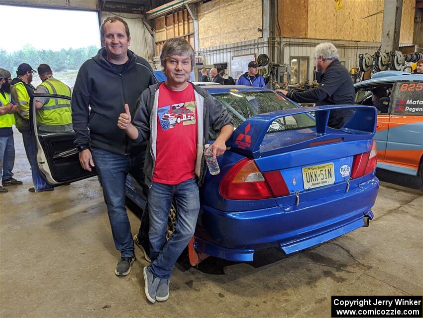 Dmitri Kishkarev / Keegan Helwig Mitsubishi Lancer Evo IV before the event. Dmitri is standing next to Niels Kroeze.