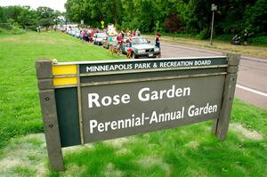 Cars on display near the Rose Garden at Lake Harriet.