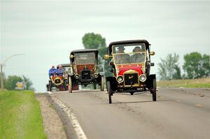 Jim Laumeyer's 1910 Maxwell leads a trail of antique cars.