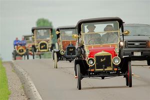 Jim Laumeyer's 1910 Maxwell leads a trail of antique cars.