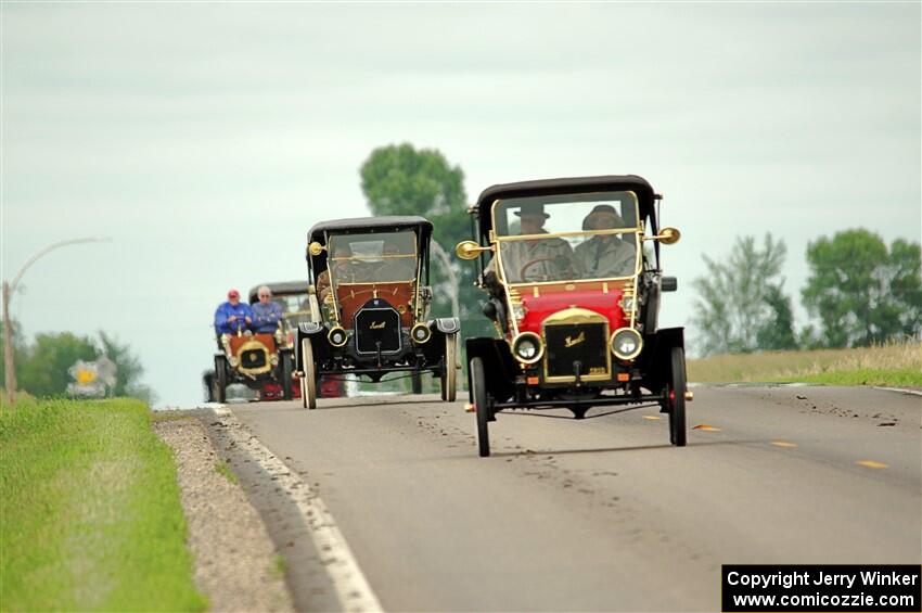 Jim Laumeyer's 1910 Maxwell leads a trail of antique cars.