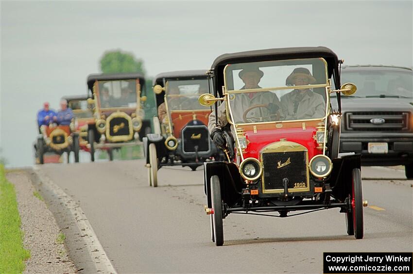 Jim Laumeyer's 1910 Maxwell leads a trail of antique cars.