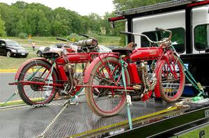 A 1912 Indian motorcycle in the foreground, and 1911 Indian motorcycle in the background.