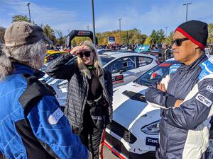 Phil Barnes, Hannah McKillop and Al Kaumeheiwa converse at parc expose.