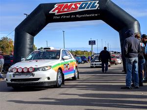 Sam Jacques / Trevor Lacombe Subaru Impreza leaves the ceremonial start.
