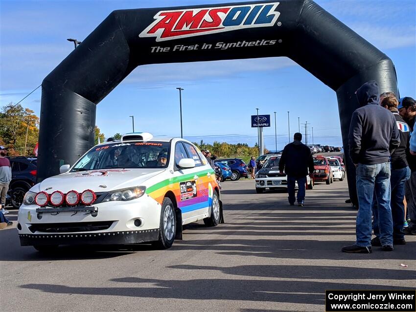 Sam Jacques / Trevor LaCombe Subaru Impreza leaves the ceremonial start.