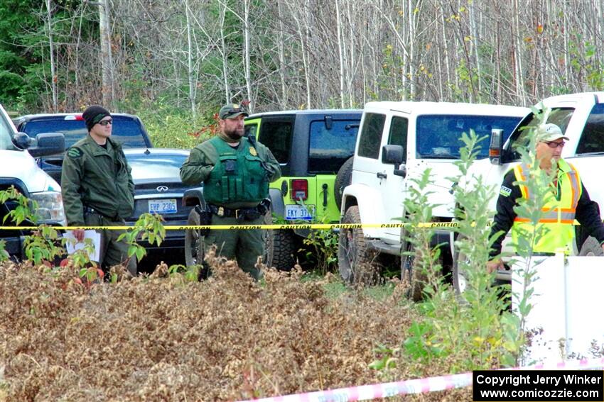 DNR wardens watching the action and keeping an eye on spectators from the sidelaines.