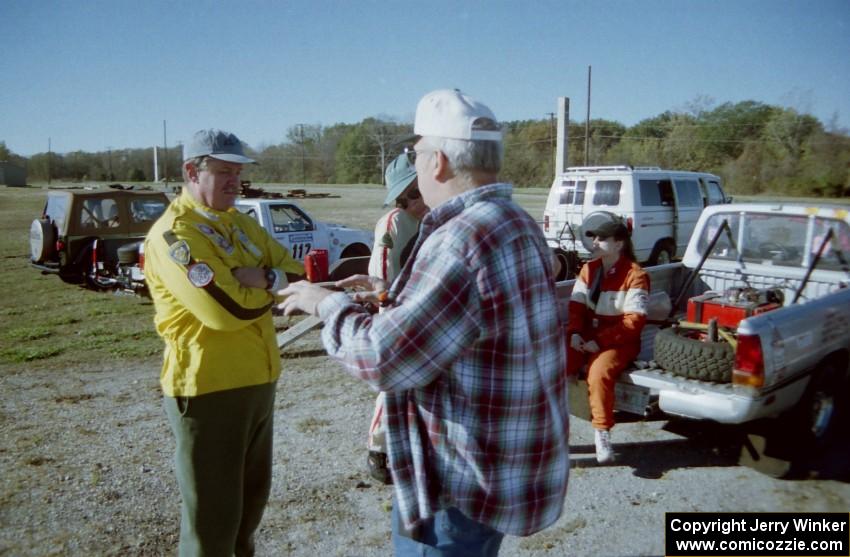 Mike Halley and Bruce Weinman chat before the start of the event as Emily Burton-Weinman takes a breather.