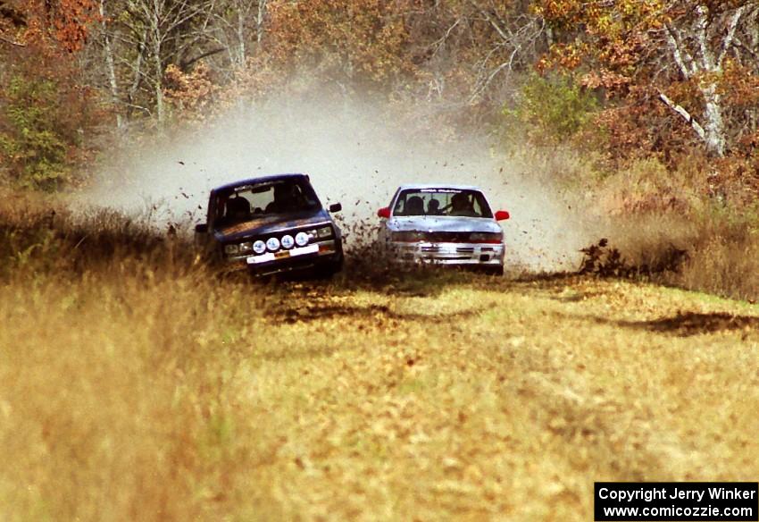 The Todd Jarvey / Rich Faber Mitsubishi Galant VR4 passes the Mike Halley / Emily Burton-Weinman Dodge Ram 50.