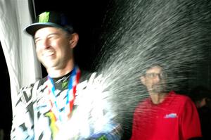 Alex Gelsomino sprays champagne after winning the event.