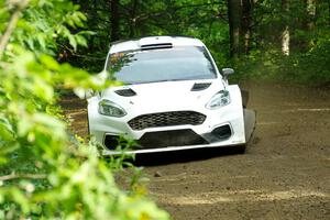 Allen Dobasu / Patrick Walsh Ford Fiesta shreds a left-front tire on SS5, Crossroads II.