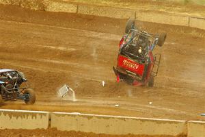 Robin Shute flips his Can-Am Maverick X3 after landing hard from a jump.