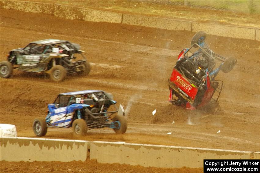 Robin Shute flips his Can-Am Maverick X3 after landing hard from a jump.